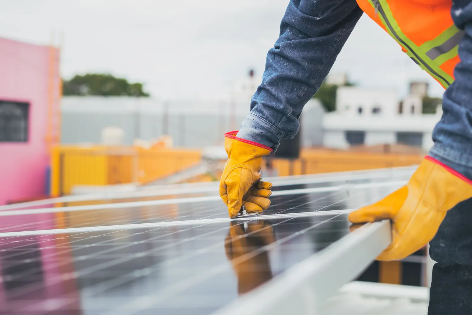 A mounting clamp being fastened to a solar panel rail