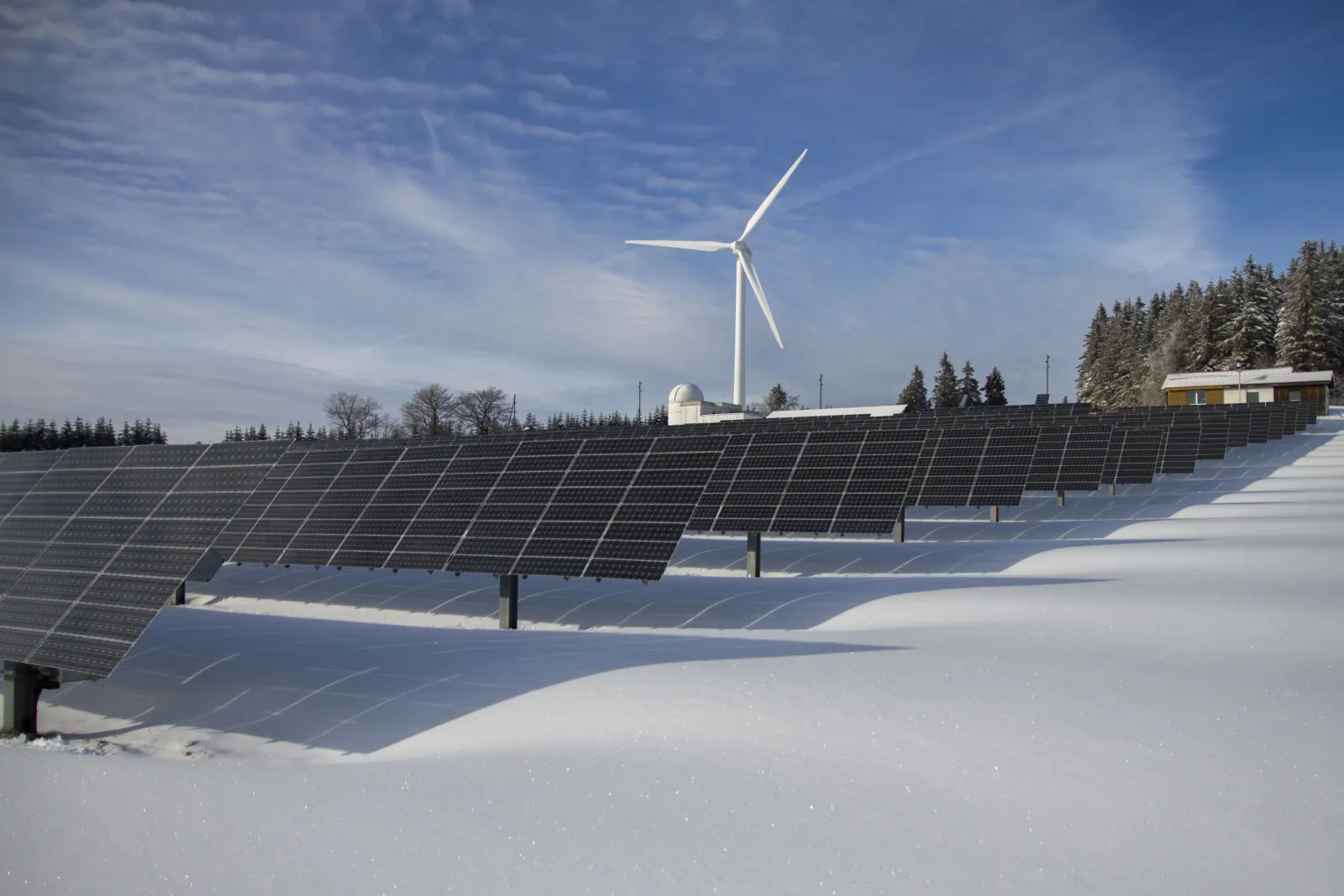 A ground-mounted solar array in winter conditions